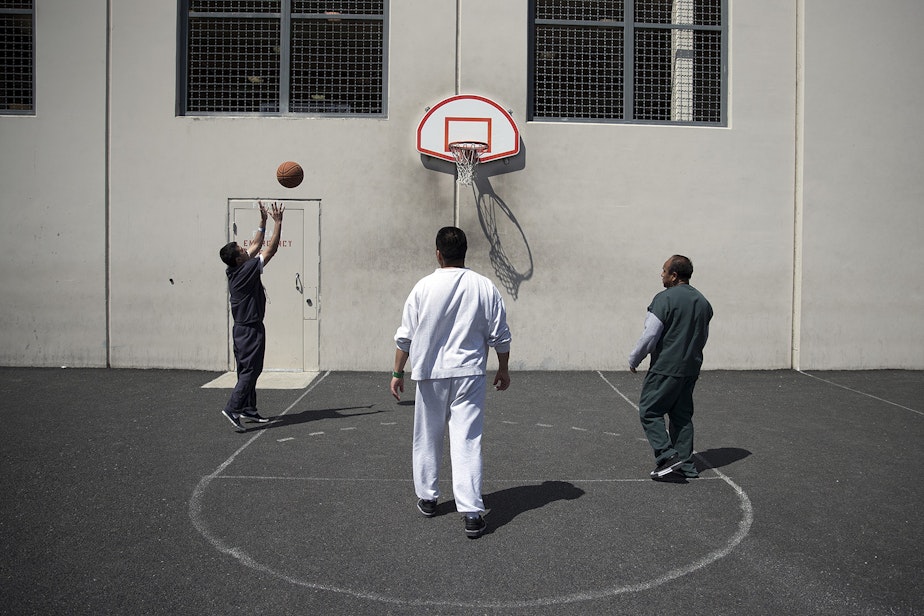caption: FILE: Detainees play basketball at the Northwest Detention Center in Tacoma