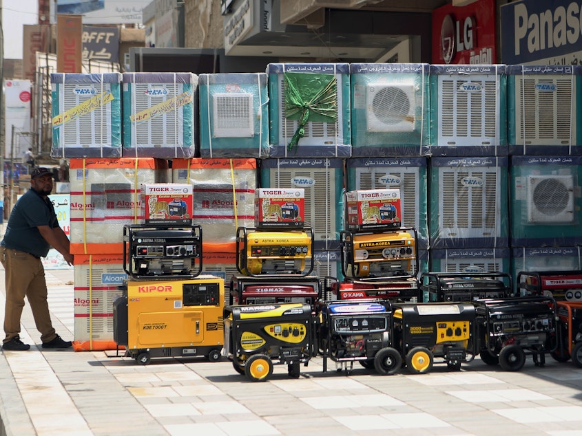 caption: Air conditioners on display in Baghdad. Congress' coronavirus relief package will also reduce the use of hydrofluorocarbons, putting the U.S. in line with an international agreement to fight climate change.