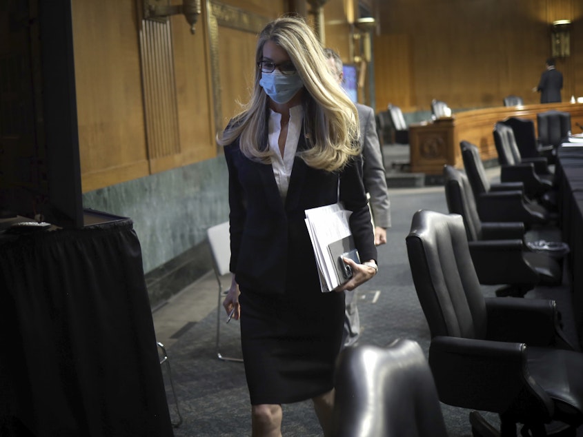 caption: Sen. Kelly Loeffler, R-Ga., leaves after a virtual Senate Committee for Health, Education, Labor, and Pensions hearing on May 12.