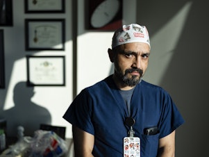 caption: Dr. Mikael Petrosyan, associate chief of general and thoracic surgery, poses for a portrait in his office at Children's National Hospital in Washington, D.C. on November 13, 2023.
