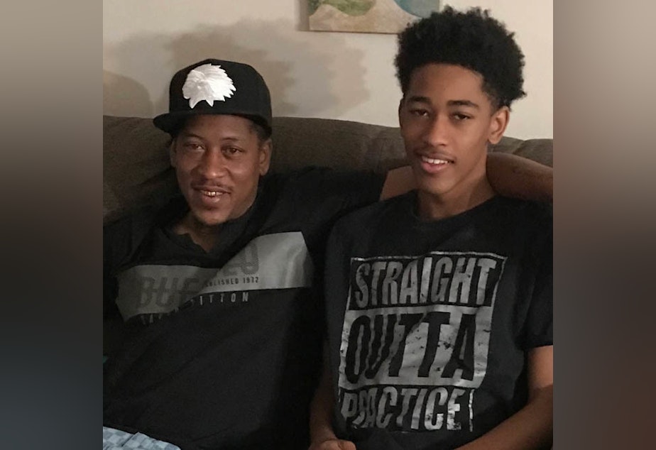 caption: Albert Sykes, left, with his eldest son, Aidan, at home this week in Jackson, Miss.