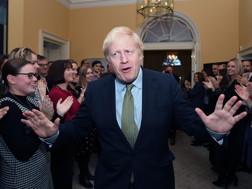 caption: Prime Minister Boris Johnson and his staff returns to 10 Downing Street after visiting Buckingham Palace, where he was given permission to form the next government during an audience with Queen Elizabeth II.