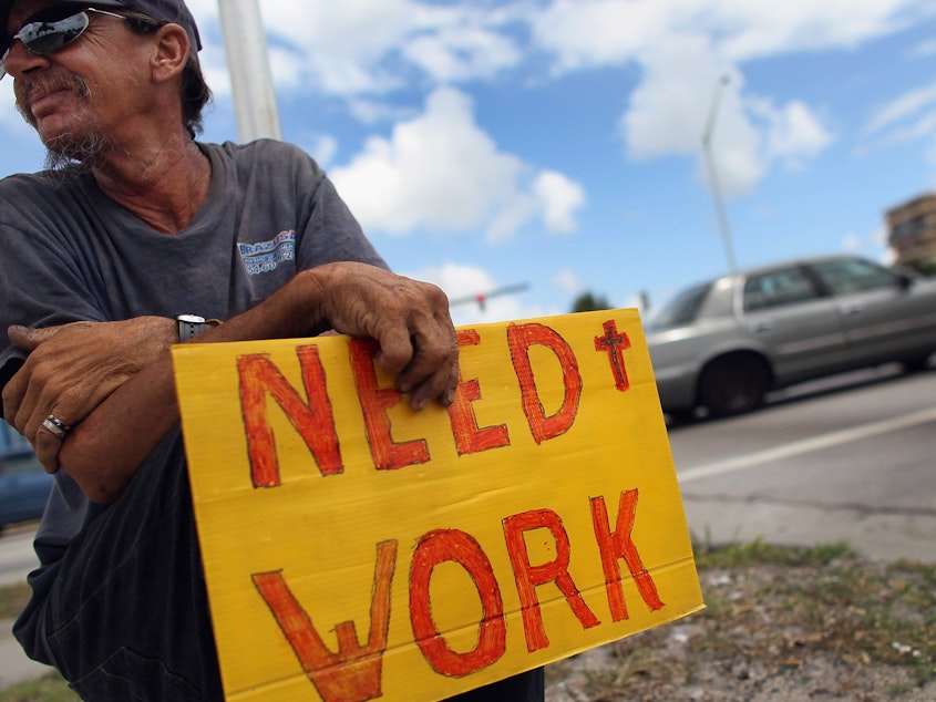 caption: The unemployment rate jumped in October, but layoffs are still rare.