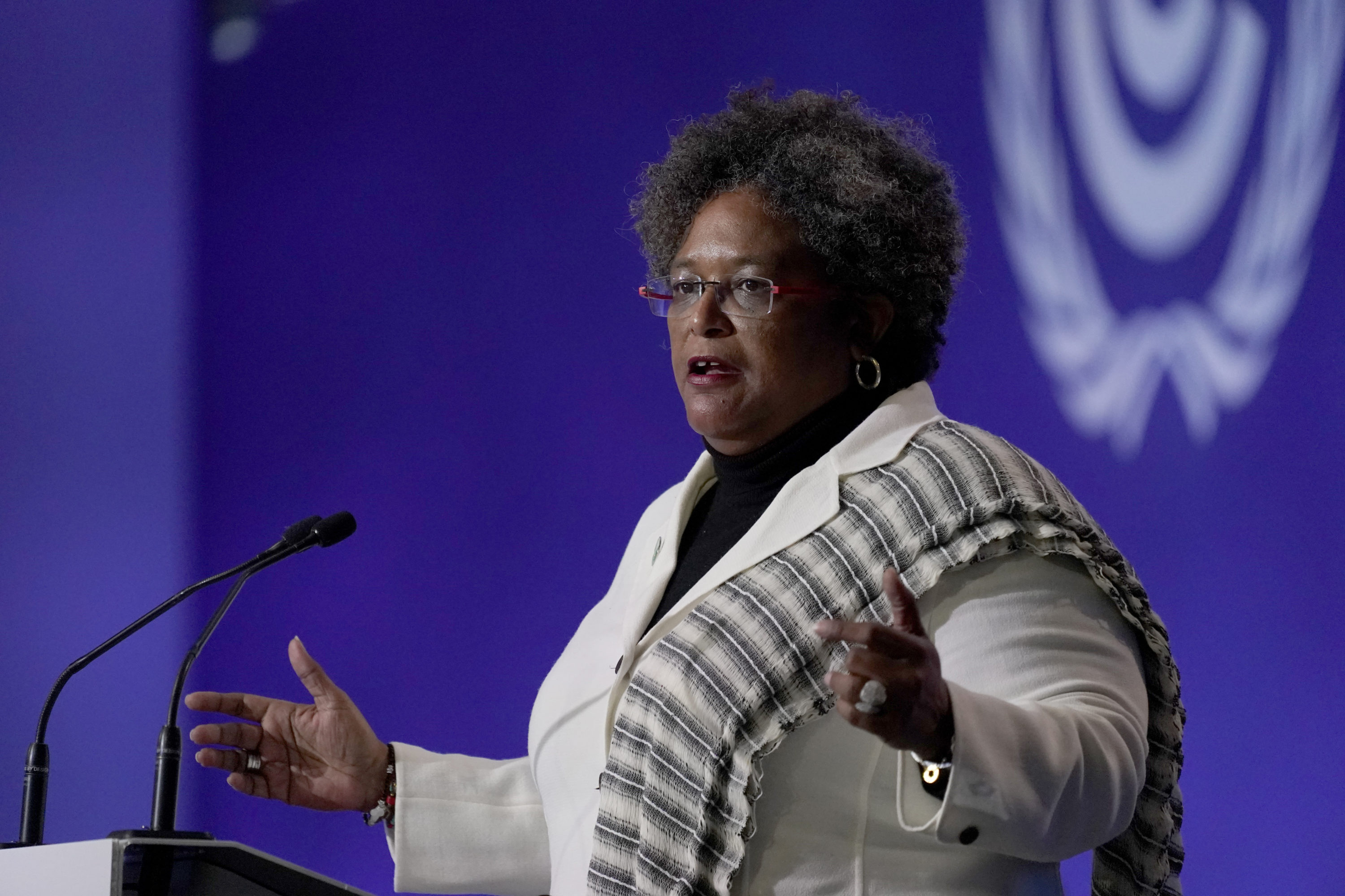 caption: The Prime Minister of Barbados Mia Amor Mottley speaks during the opening ceremony of the COP26 U.N. Climate Summit, in Glasgow, Scotland, Monday, Nov. 1, 2021. (Alberto Pezzali/AP)