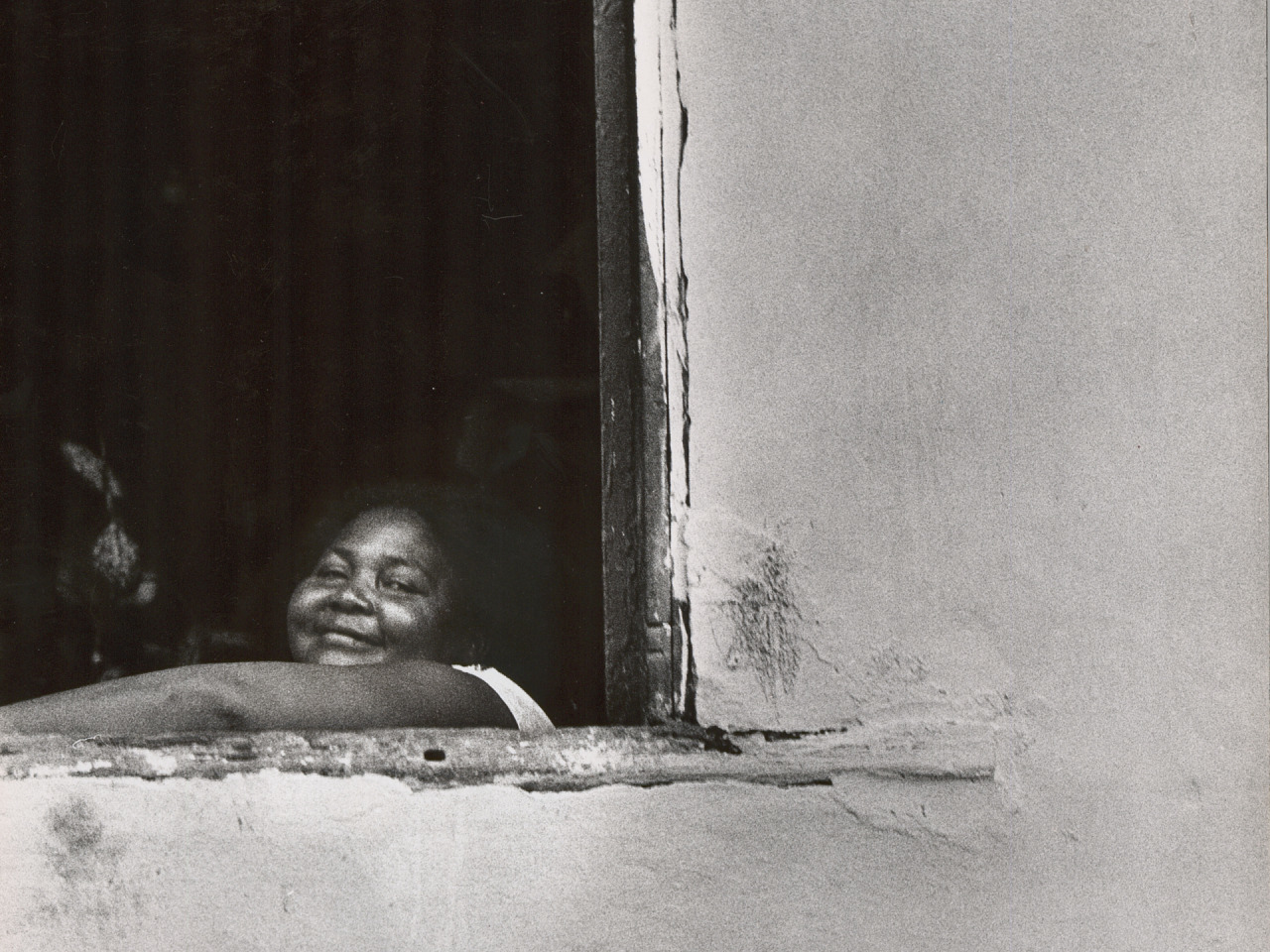 caption: Looking out of an adobe window. Salvador, Brazil, 1963.