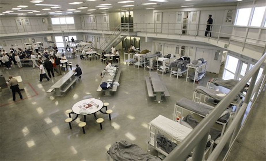 caption: This Friday, Oct. 17, 2008 file picture shows the "B" cell and bunk unit of the Northwest Detention Center in Tacoma, Wash. 
