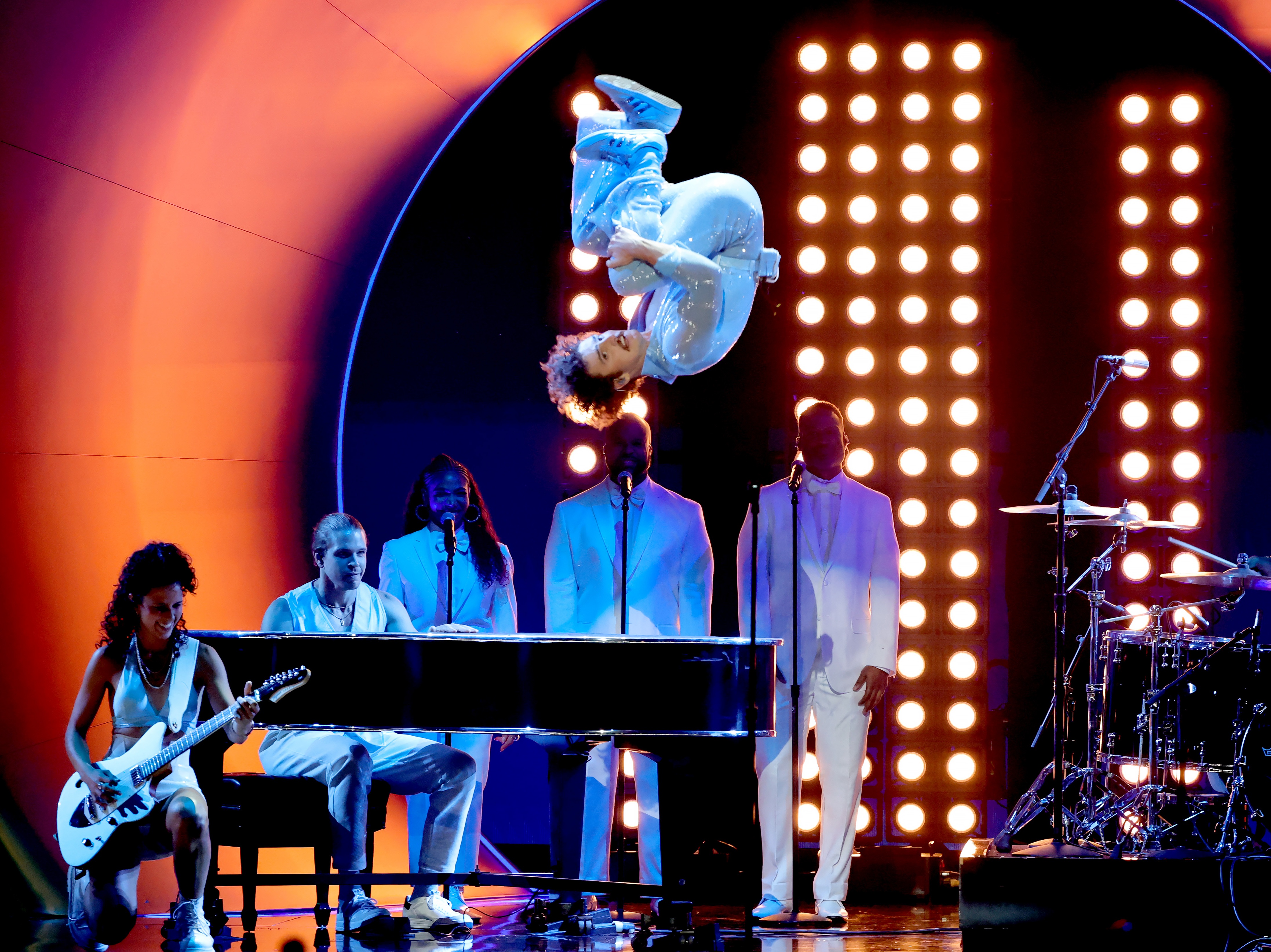 caption: Benson Boone does a flip off the piano while performing his hit "Beautiful Things" at the Grammy Awards in Los Angeles on Feb. 2, 2025. Boone was one of several rising artists who made their Grammy debuts this year with far more adeptness than most rookies.
