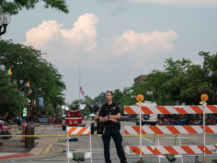 caption: Downtown Highland Park, Ill., remained roped off Tuesday afternoon after the deadly shooting at a July 4th parade.
