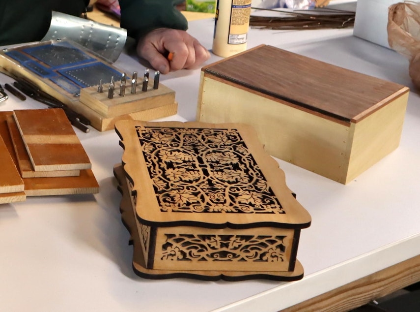 caption: Wood boxes crafted from scraps salvaged from an old piano.