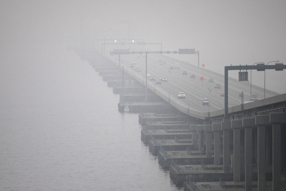 caption: The SR 520 bridge disappears from view as smoke from wildfires burning in California and Oregon continues to blanket the area, on Monday, September 14, 2020, in Seattle. The air quality in the region has fluctuated between unhealthy, very unhealthy and hazardous. 