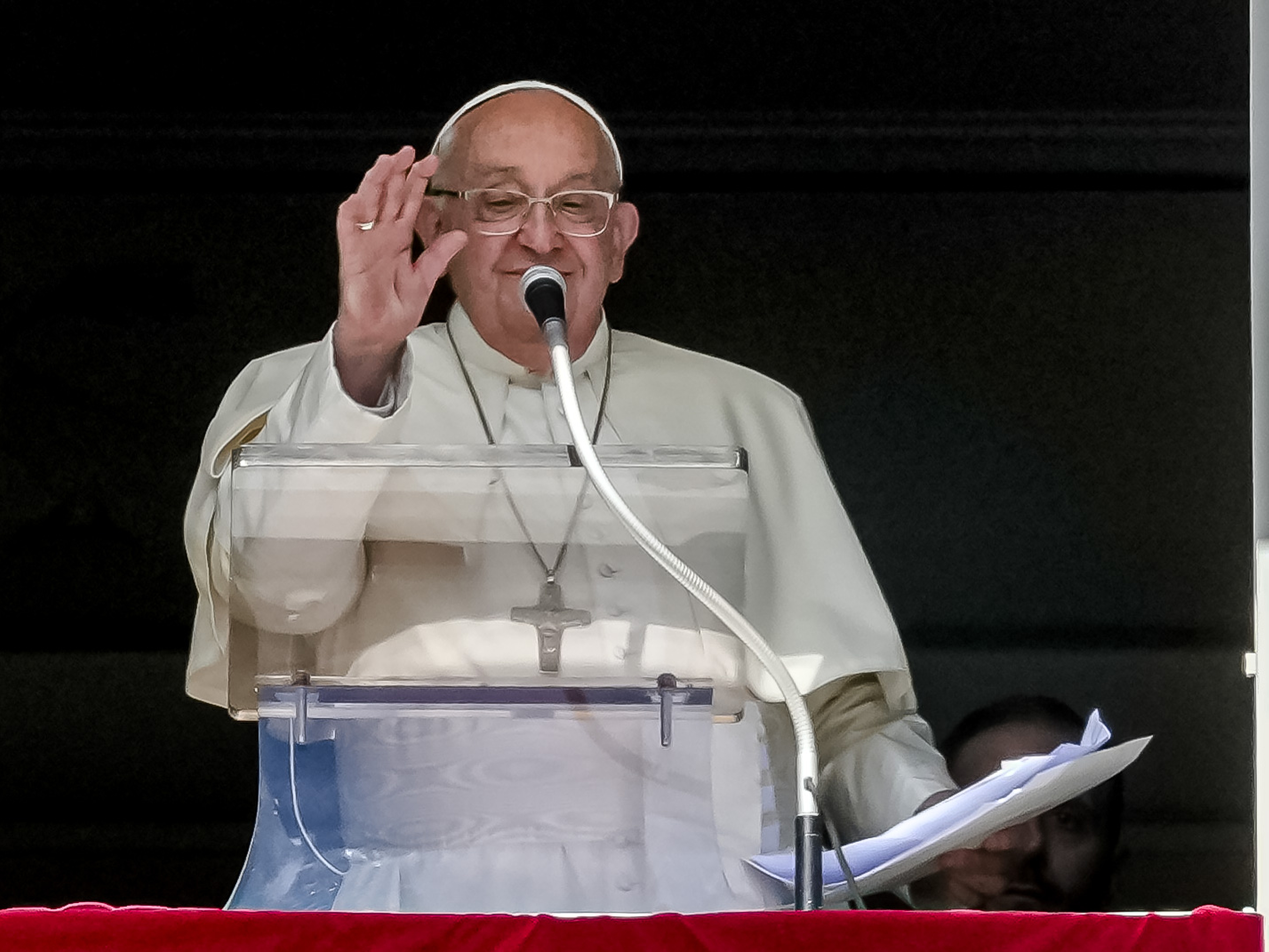 caption: Pope Francis appears at his studio window for the traditional noon blessing of faithful and pilgrims gathered in St. Peter's Square at The Vatican, Sunday, Oct. 6, 2024.