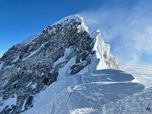 caption: Kami Rita Sherpa climbed Mount Everest for the 26th time Saturday, setting a new world record for most times summitting the world's tallest peak.