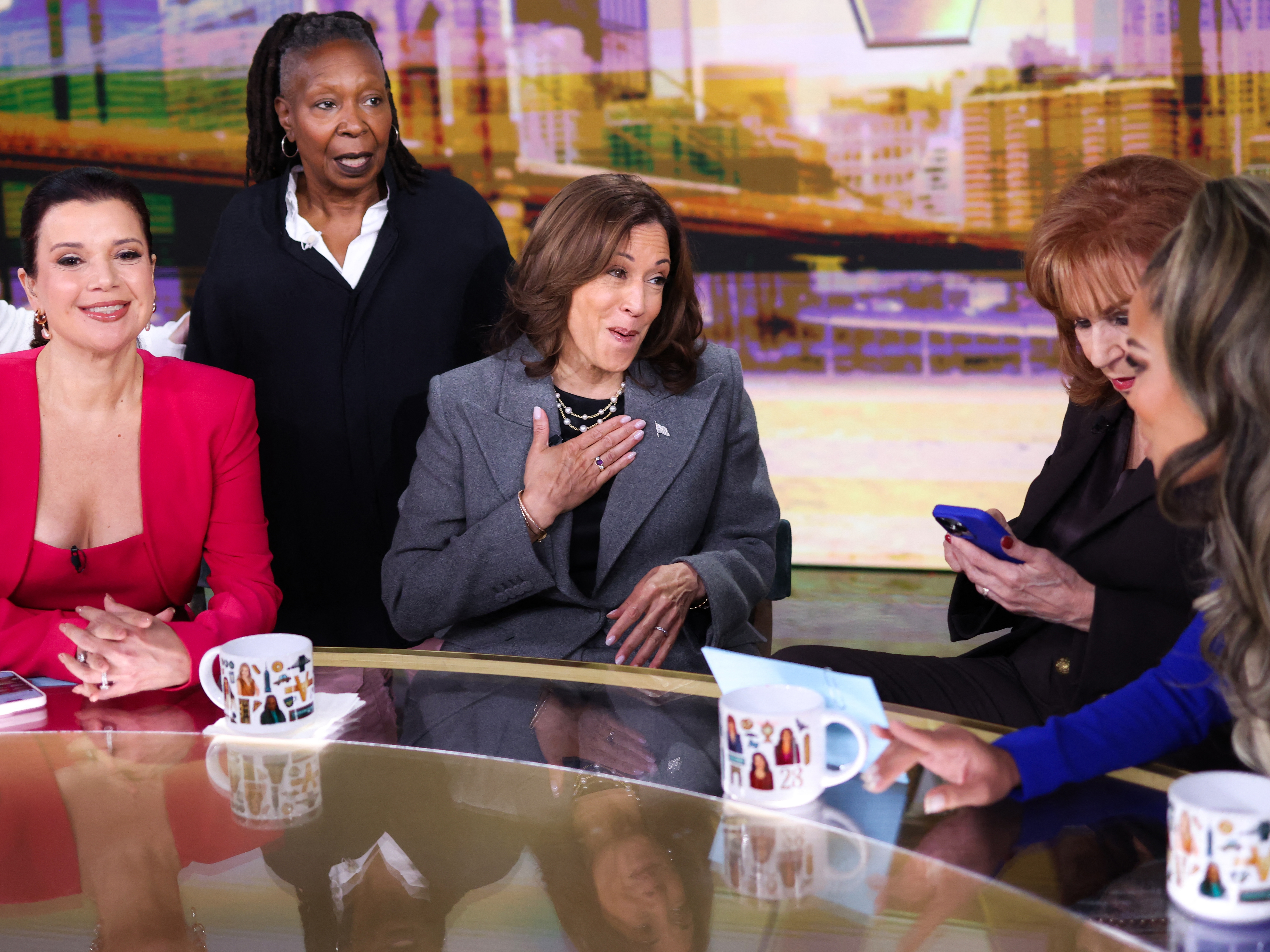 caption: Vice President Harris talks to hosts of ABC's <em>The View</em> during a commercial break on Oct. 8.