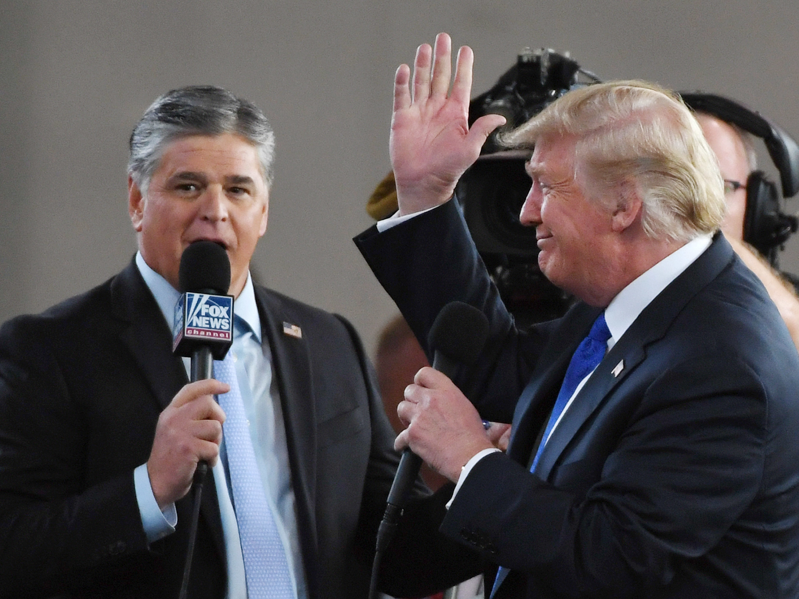 caption: Fox News Channel and radio talk show host Sean Hannity interviews President Trump in Las Vegas in 2018. Hannity, like Trump, has cast doubt on the 2020 election results without providing evidence.