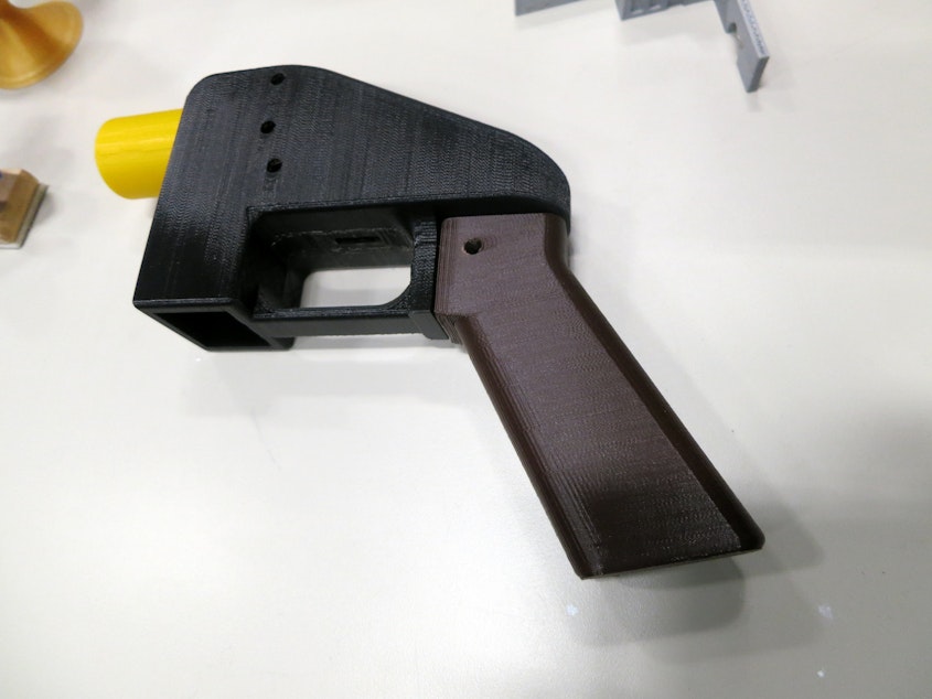 caption: A 3D-printed gun.