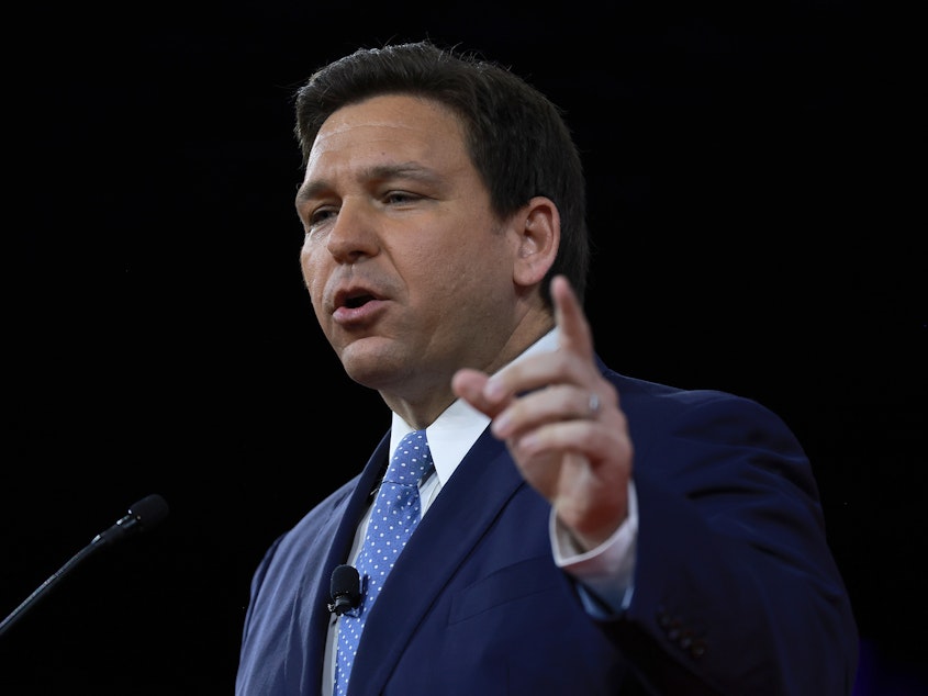 caption: Florida Gov. Ron DeSantis has signed the state's new abortion ban into law. It bans abortions after 15 weeks of pregnancy.
