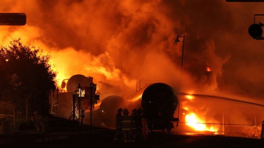 caption: United States safety regulators have adopted an emergency order requiring tests of crude oil before shipment by rail. The move is in response to a string of explosions and fires, like this one in Quebec, which claimed 47 lives.