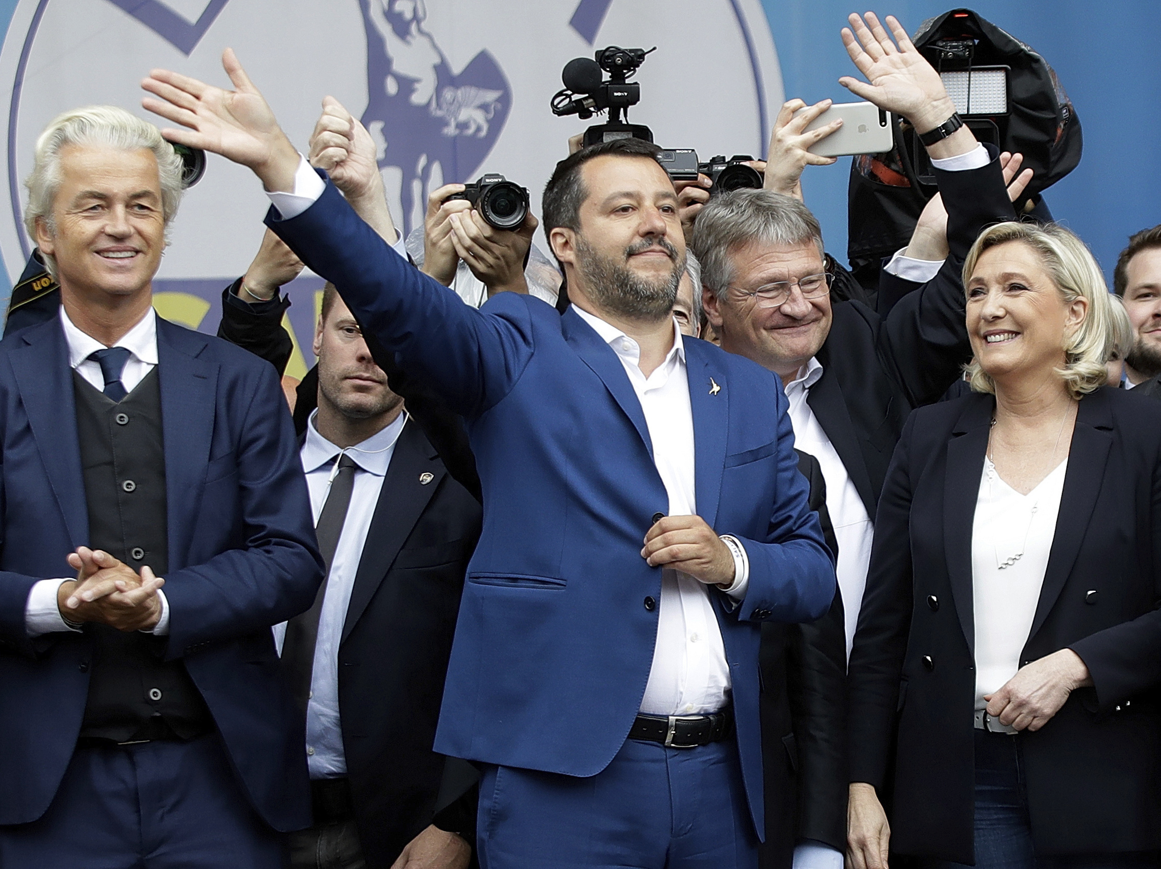 caption: Matteo Salvini (center), flanked by European nationalist leaders, attends a rally ahead of the May 23-26 European Parliamentary elections, in Milan on Saturday.