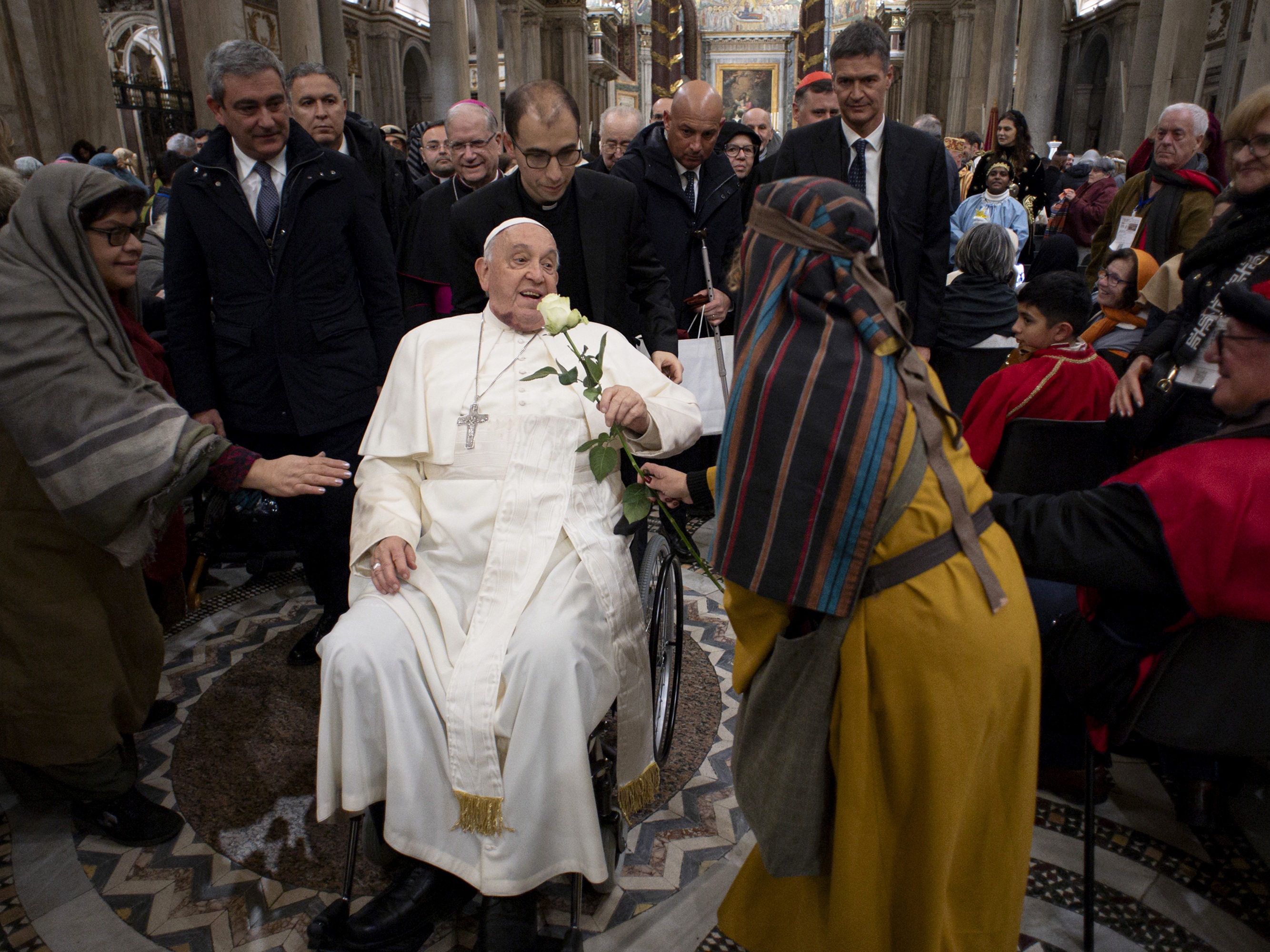caption: Pope Francis greets participants to the Living Nativity Scene at the Basilica of St. Mary Major on December 14, 2024 in Rome, Italy. He will be laid to rest in the Basilica after his funeral in the Vatican on Saturday.
