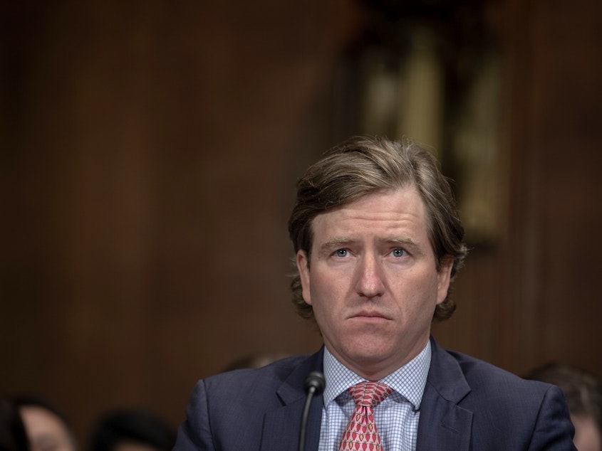 caption: Christopher Krebs, director of the Cybersecurity and Infrastructure Security Agency, speaks before the Senate Judiciary Committee in May 2019.