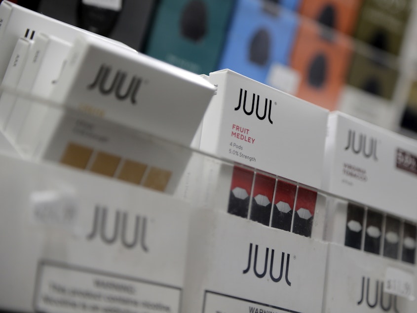 caption: Juul products are displayed at a smoke shop in New York on Dec. 20, 2018.