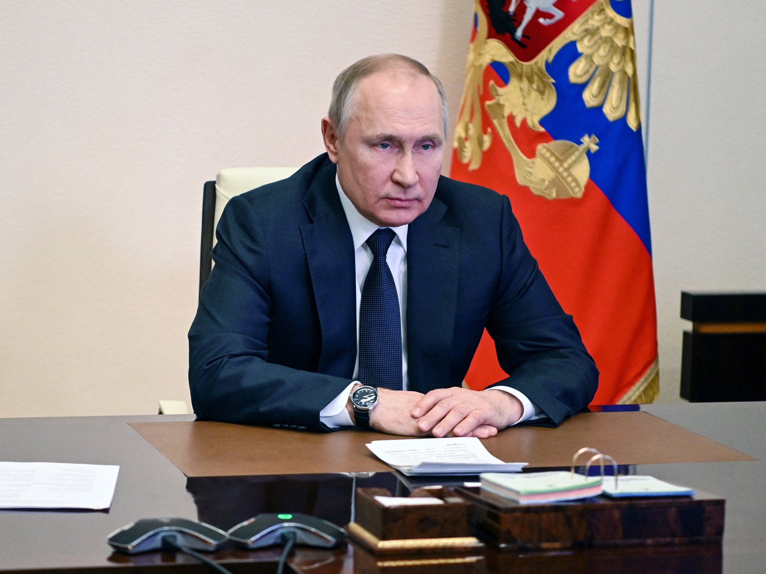 caption: Russian President Vladimir Putin chairs a Security Council meeting via teleconference call at the Novo-Ogaryovo state residence outside Moscow on March 3.