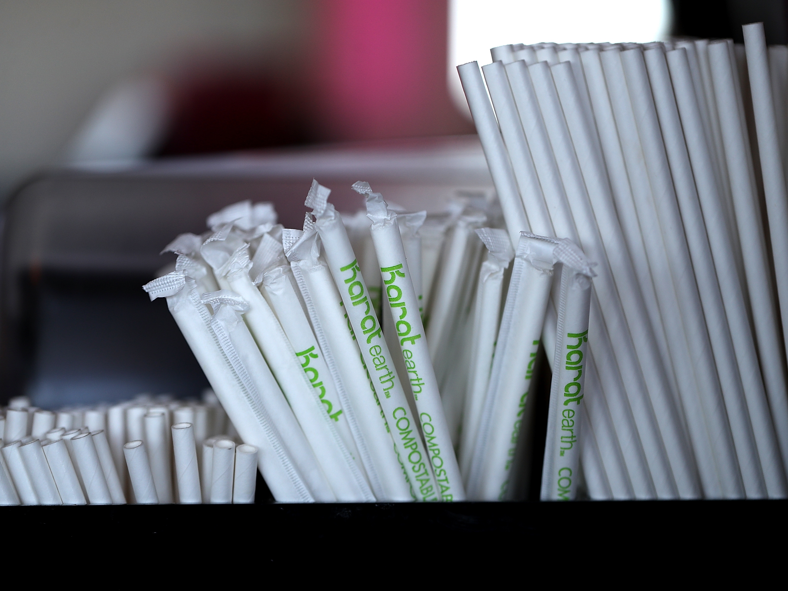caption: Paper straws sit on a bar in San Francisco in 2018. President Trump has signed an executive order decrying the "irrational campaign against plastic straws" and directing federal agencies to stop buying paper straws.