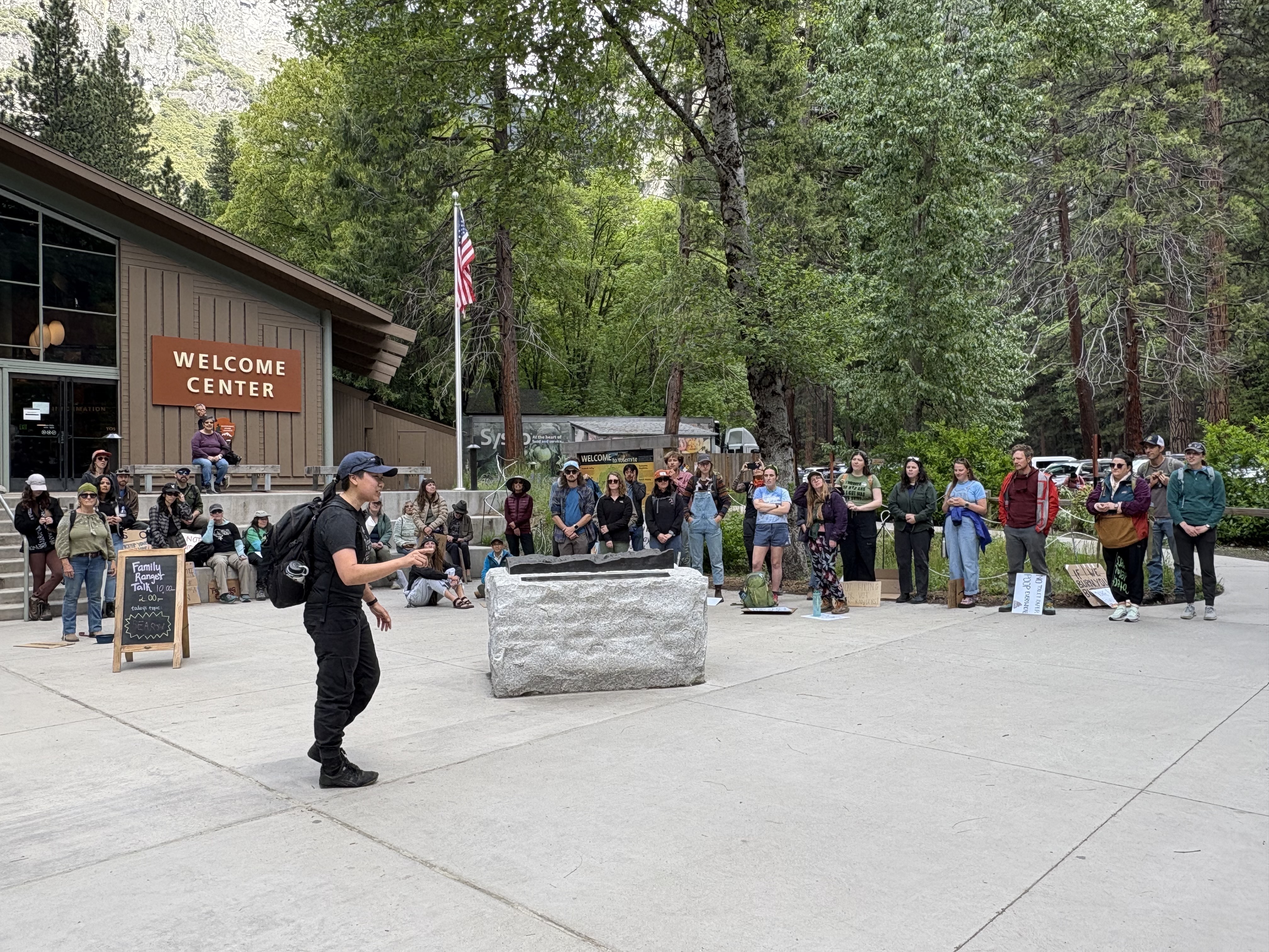 caption: At the Yosemite Village, park employees and locals protest the federal government's actions to reduce staffing.