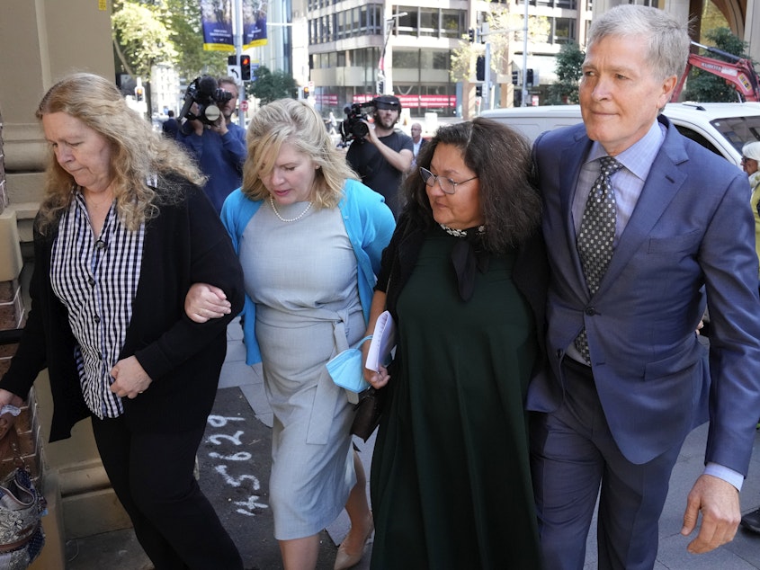 caption: Steve Johnson with his sisters, Terry, left, and Rebecca and his wife Rosemarie, second right, arrive at the Supreme Court in Sydney on Monday for a sentencing hearing in the murder of Scott Johnson — Steve, Terry and Rebecca's brother.