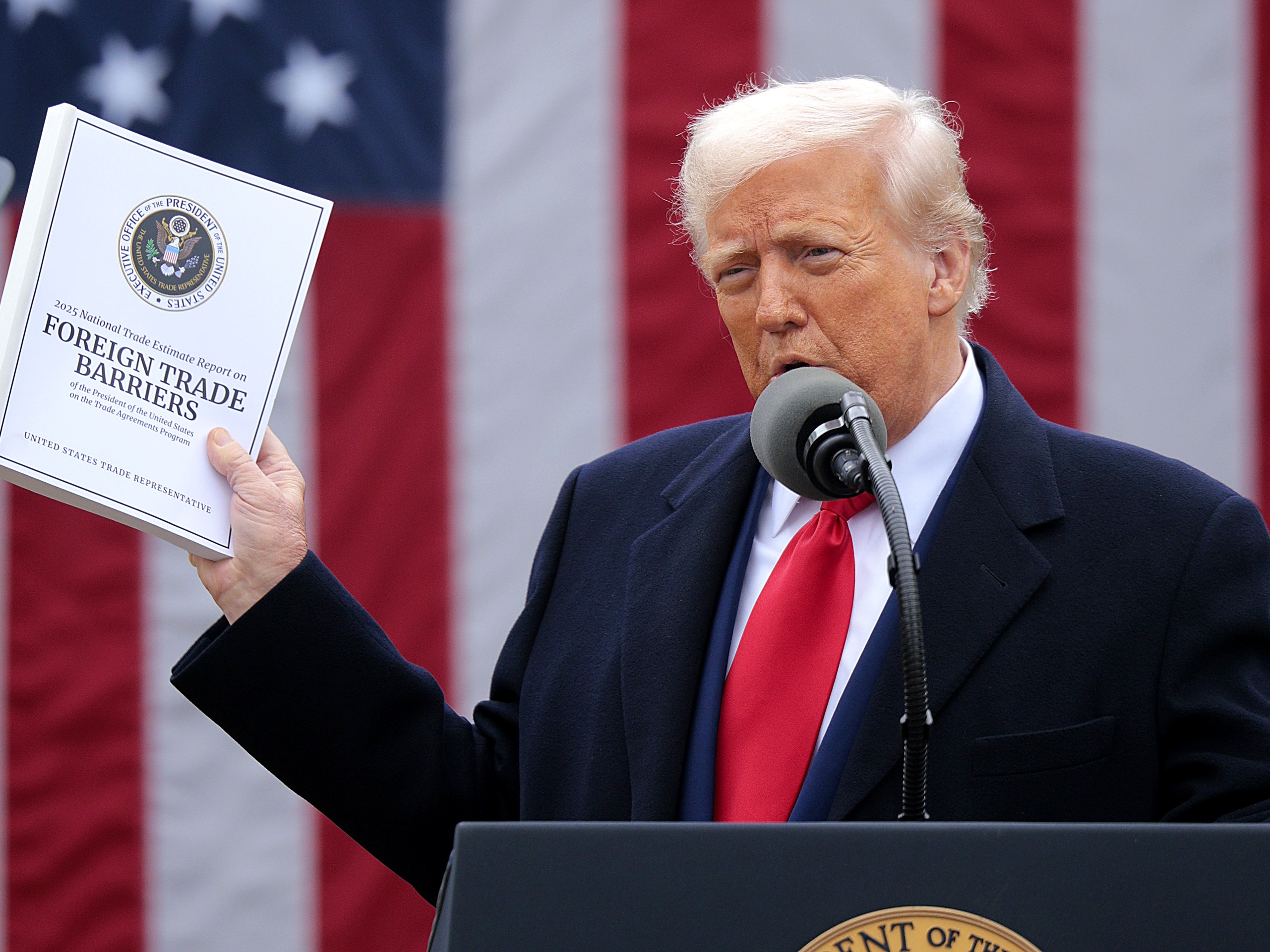 caption: President Trump announced his latest tariffs at a Rose Garden event at the White House in Washington, D.C., on April 2. The International Monetary Fund cut its forecasts for the global economy this year, citing the risks from an all-out trade war.