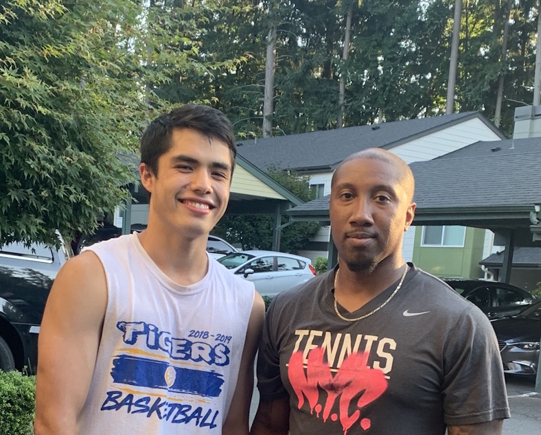caption: Gabe Rambayon with his teacher and basketball coach, Jeffrey Forbes Jr.