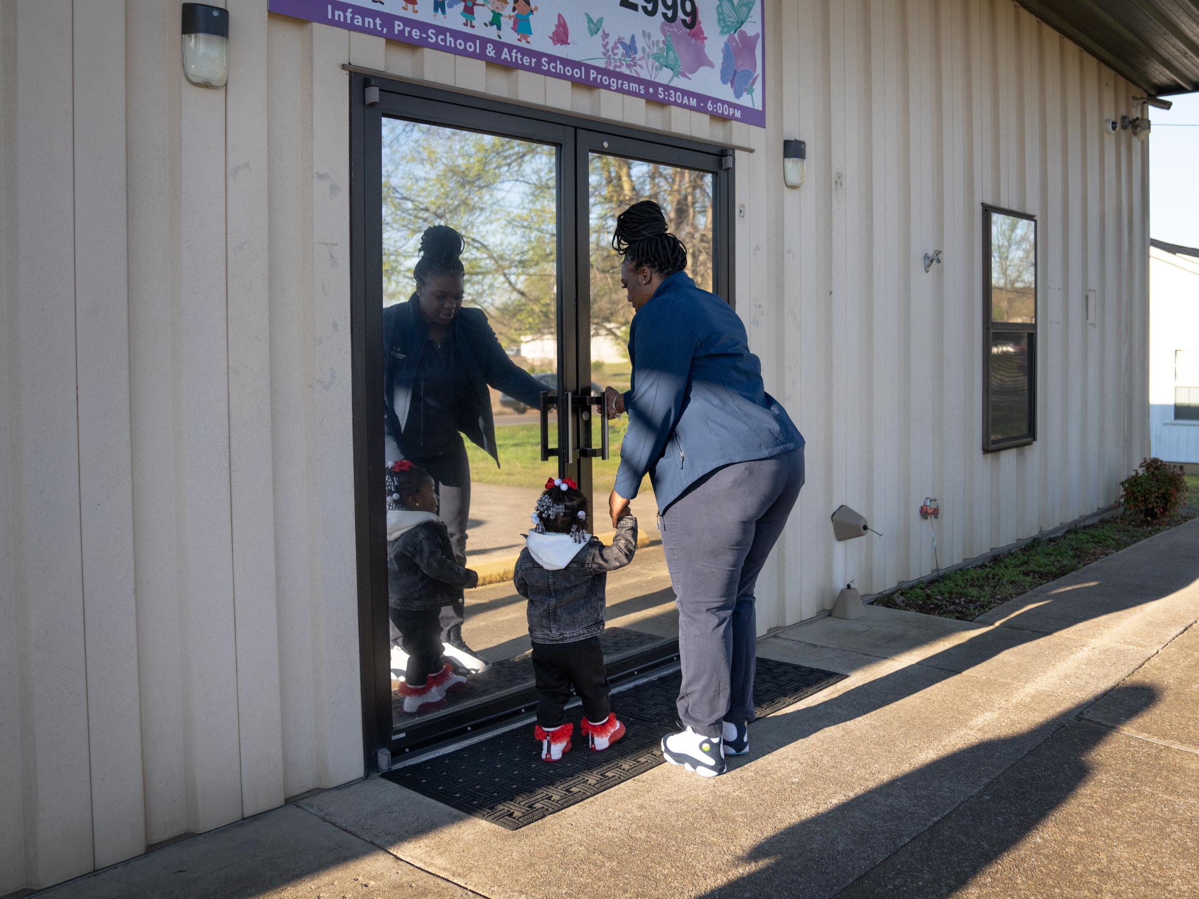 caption: On her way to work at the Mazda Toyota Manufacturing plant in northern Alabama, D'Koya Mathis takes her 2-year-old daughter Zharia to Ms. Pat's Child Care & Development Center.