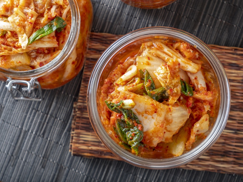 caption: Korean kimchi, made of salted and fermented vegetables, contains microbes that contribute to its distinctive taste.