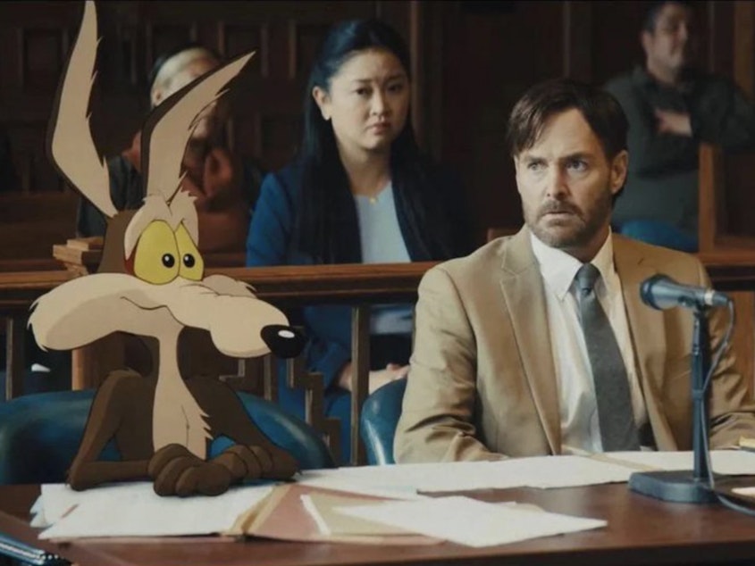 caption: Wile E. Coyote and actor Will Forte are seen in a still image from the film <em>Coyote vs. Acme</em>. Eric Bauza, another actor in the film, posted the image online in December.