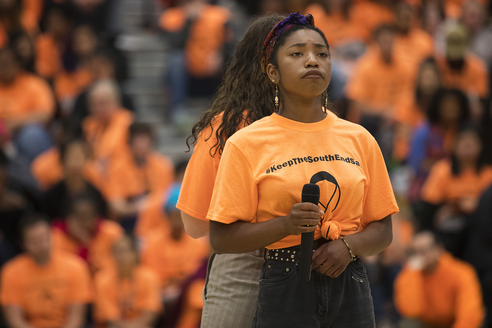 caption: Savannah Blackwell, right, and Annabelle Russell, Franklin High School freshmen, perform a song during an assembly remembering slain classmate Ryan Dela Cruz.