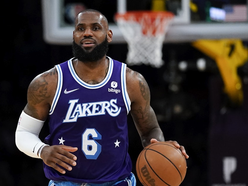 caption: LeBron James' two-year, $97.1 million contract extension with the Los Angeles Lakers makes him the highest-paid player in NBA history.