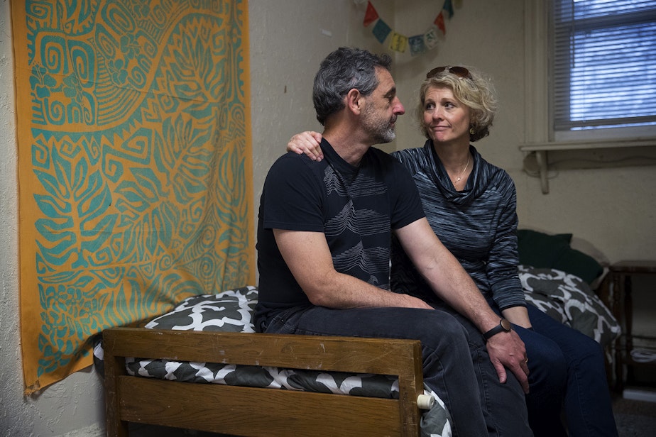 caption: Matt and Jerri Clark pose for a portrait on their 23-year-old son Calvin's bed, on Friday, March 22, 2019, after packing up his belongings at his apartment in Seattle. Calvin, who suffered from a serious mental illness, took his own life on Monday, March 18, 2019.