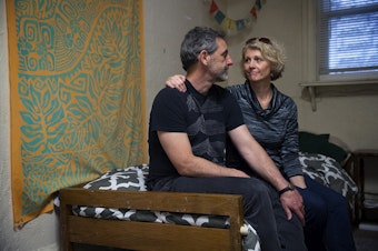 caption: Matt and Jerri Clark pose for a portrait on their 23-year-old son Calvin's bed, on Friday, March 22, 2019, after packing up his belongings at his apartment in Seattle. Calvin, who suffered from a serious mental illness, took his own life on Monday, March 18, 2019.