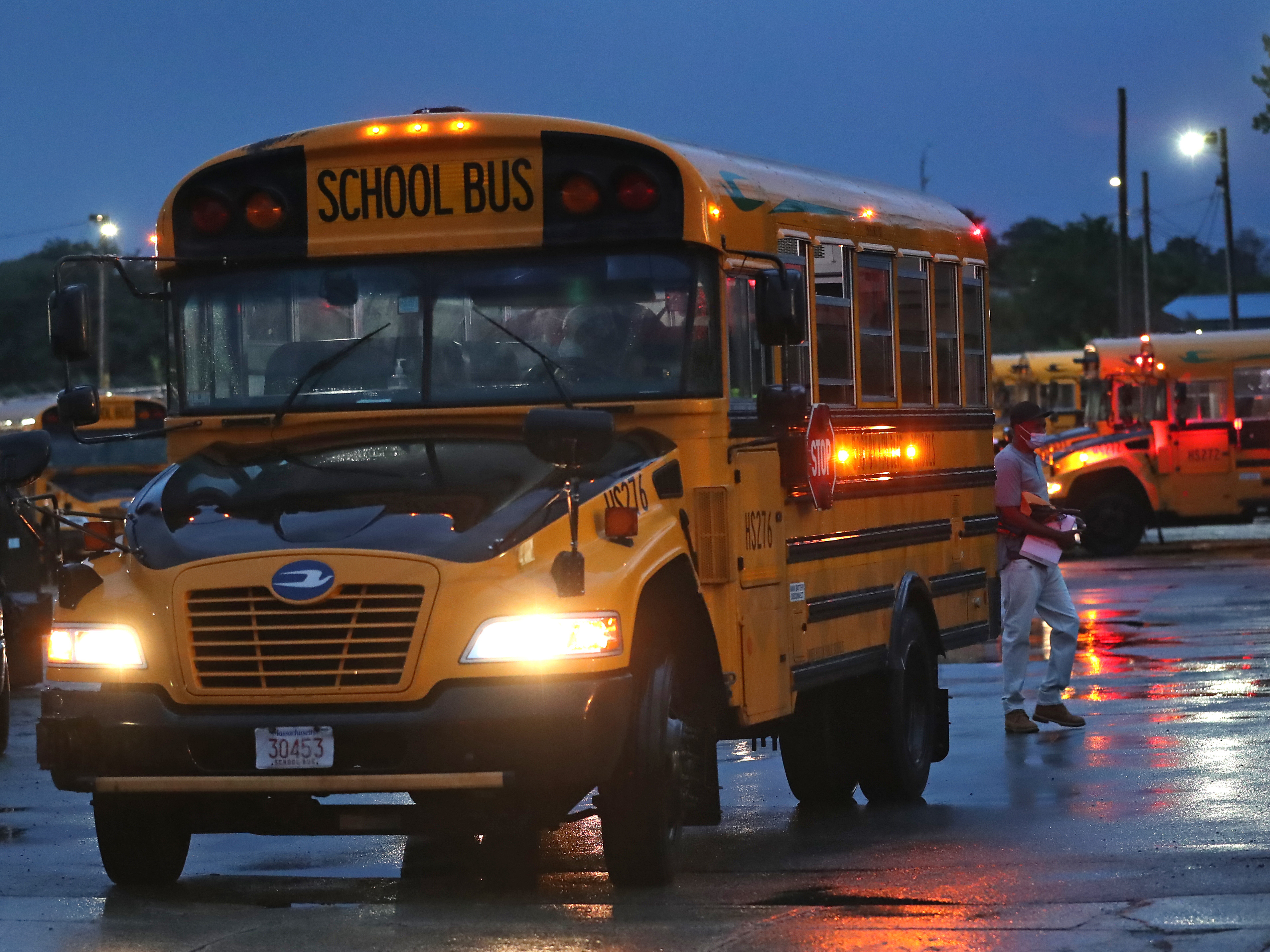 caption: A shortage of school bus drivers for the Boston Public Schools has led to some delays this month. Gov. Charlie Baker is calling up National Guard members to help alleviate the shortage in some areas of the state.