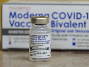 caption: A vial of the Moderna's COVID-19 vaccine, Bivalent. Though the shots are free to pretty much anyone who wants one in the U.S. as long as federal stockpiles hold out, the next update of the vaccine might be costly for some people who lack health insurance.