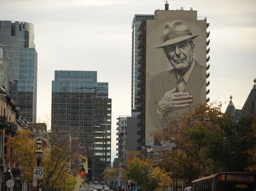 caption: A memorial mural of musician Leonard Cohen in downtown Montreal.