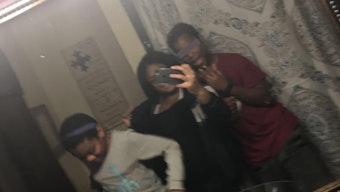 caption: Kemijah Slaughter with her younger brother and sister, a few years before this story was created. This was the last time the siblings were together, during a home visit at a relative's house.