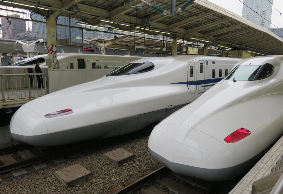 caption: Shinkansen bullet trains, seen here in Tokyo.