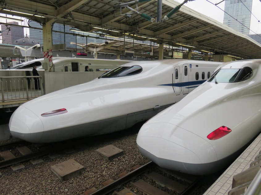 caption: Shinkansen bullet trains, seen here in Tokyo.
