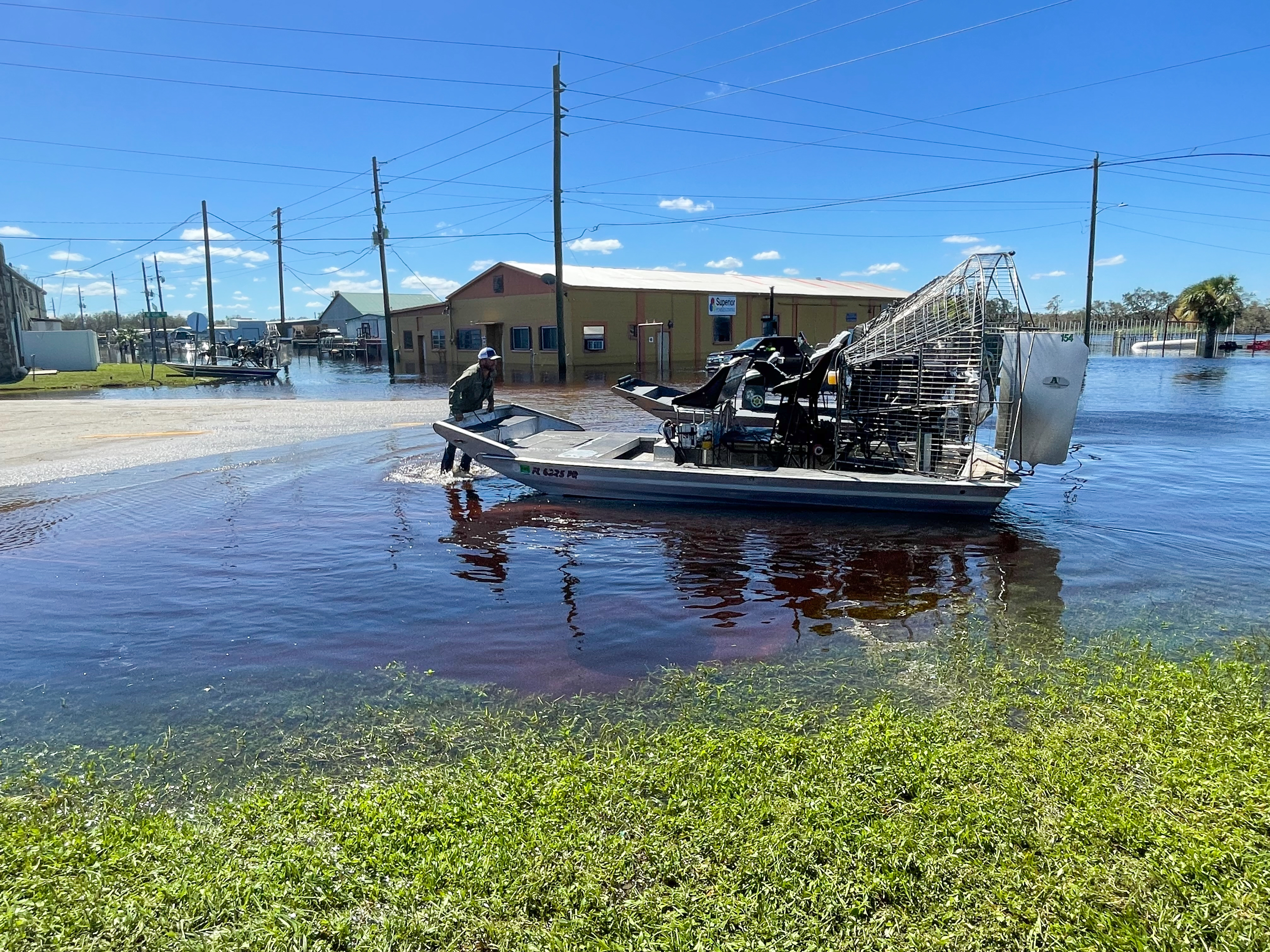 caption: DeSoto County Commissioner J.C. Deriso turns his airboat around before heading out to help hurricane survivors stranded on newly-created islands brought on by the flooding Peace River.