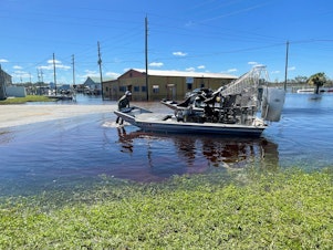 caption: DeSoto County Commissioner J.C. Deriso turns his airboat around before heading out to help hurricane survivors stranded on newly-created islands brought on by the flooding Peace River.