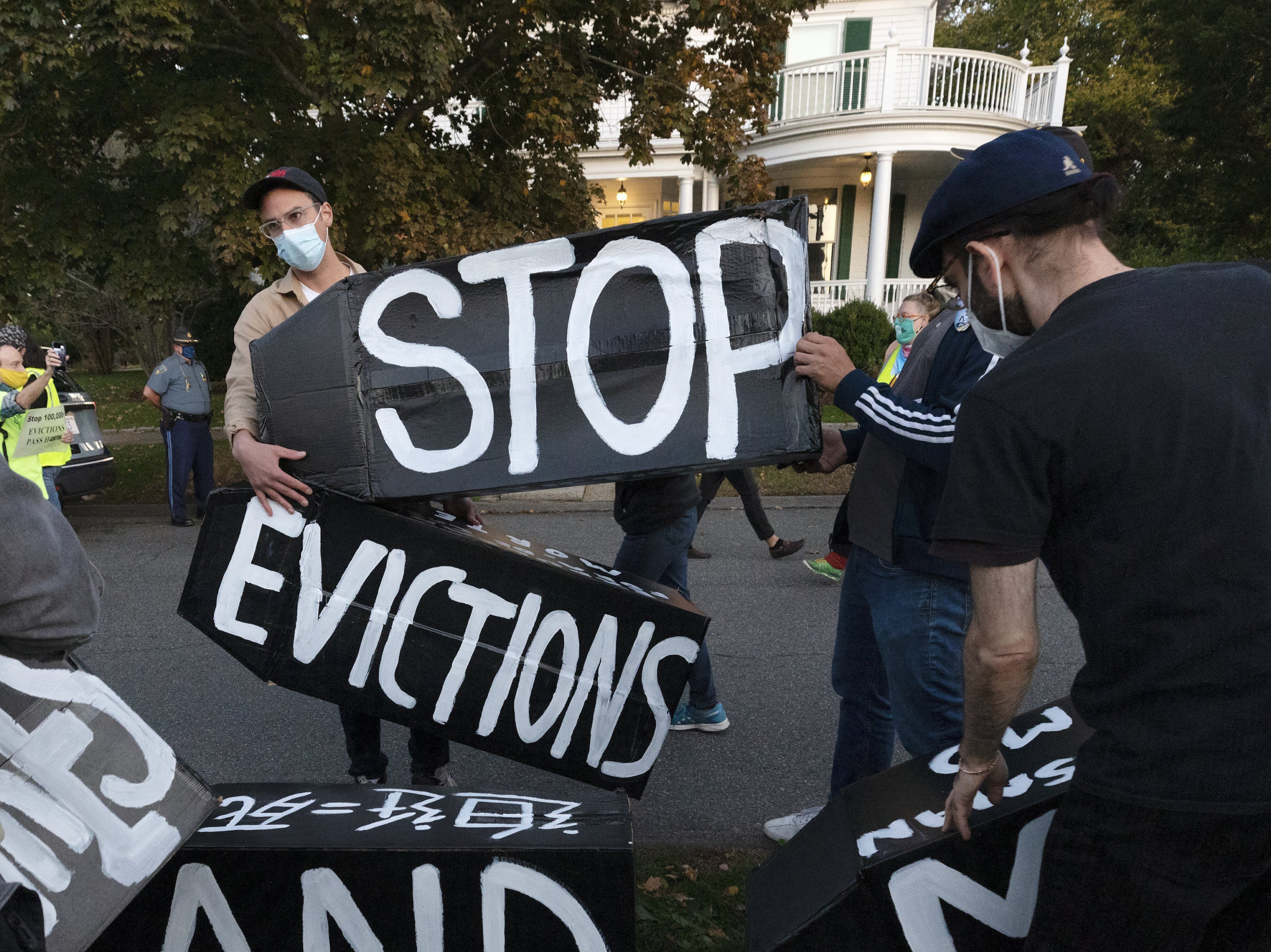 caption: Housing activists protest evictions in Massachusetts, which recently allowed its sweeping statewide eviction ban to expire. That leaves residents with only a much weaker eviction protection order from the Centers for Disease Control and prevention.