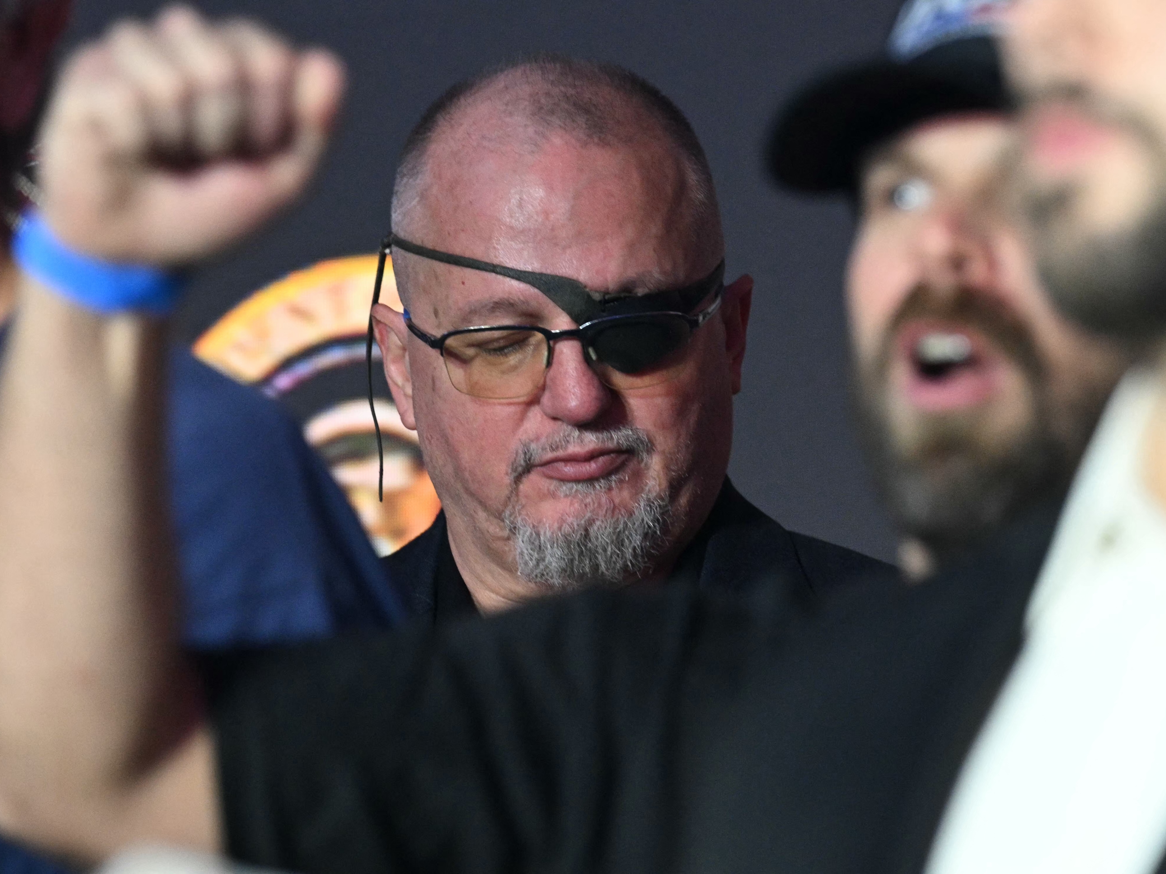 caption: Oath Keepers founder Stewart Rhodes looks on as U.S. President Trump delivers remarks on his policy to end tax on tips in Las Vegas, Nevada, on Jan. 25, 2025.