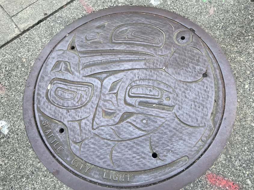 caption: Utility cover plate, downtown Seattle