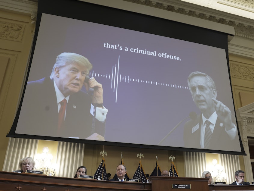 caption: The House Select Committee has used TV news techniques and documentary evidence to argue that then President Donald Trump knowingly pressured public officials to commit illegal acts. In this case, the panel displayed a transcript of his call to Georgia Secretary of State Brad Raffensperger as it played excerpts of the audio.